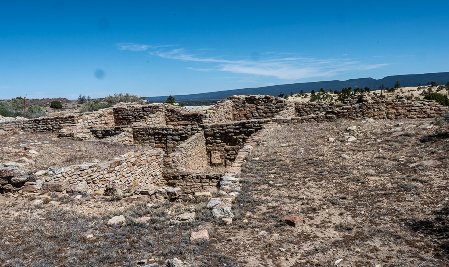 Remains of ancestral puebloan village on top of butte